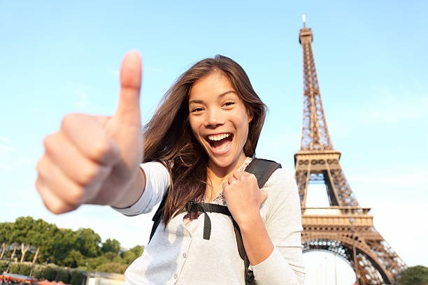 International student studying in France near the Eiffel Tower